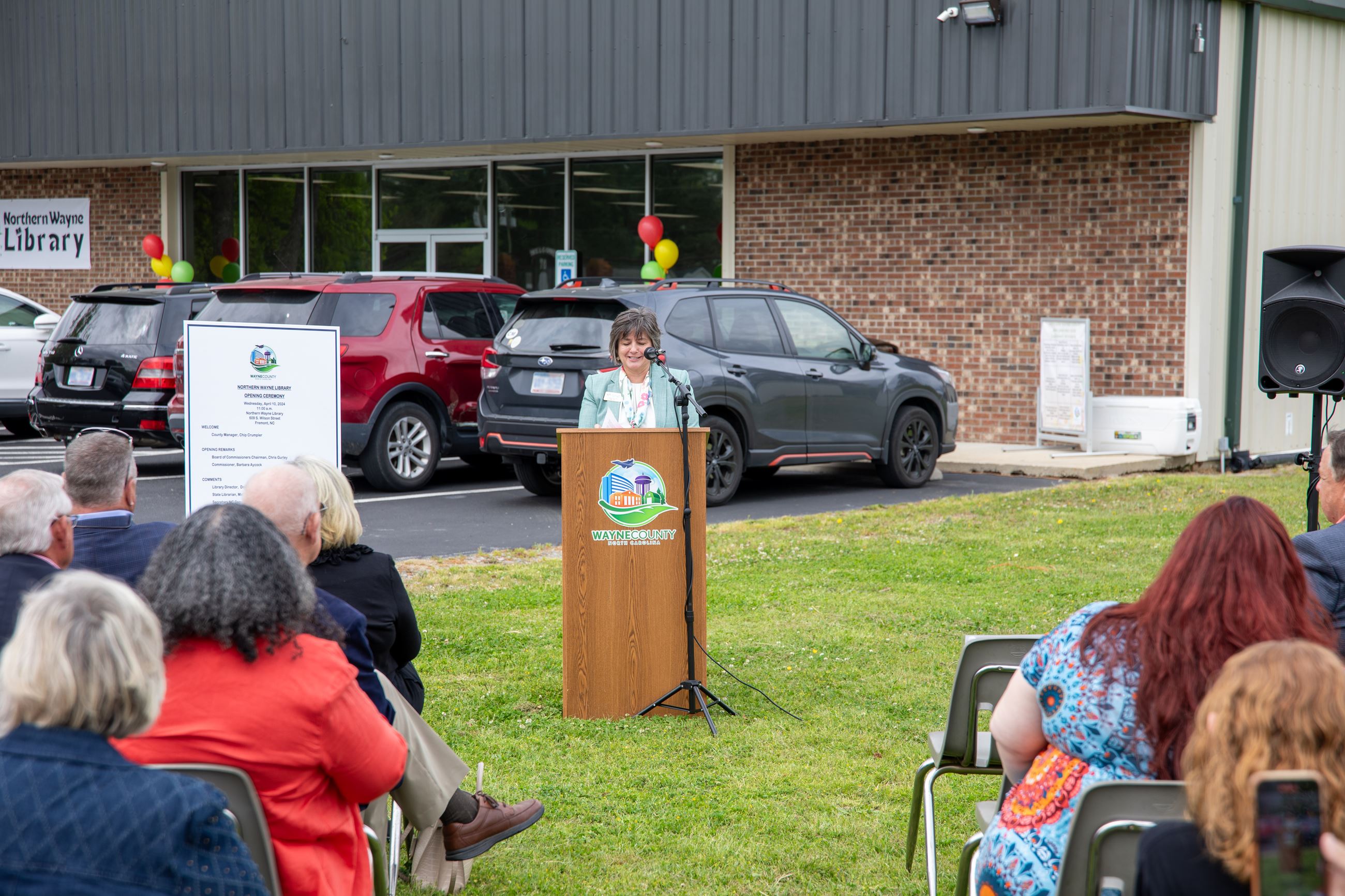 Library Director Donna Phillips speaking at podium